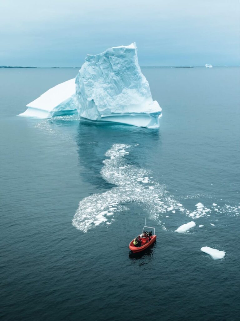 boat near iceberg
